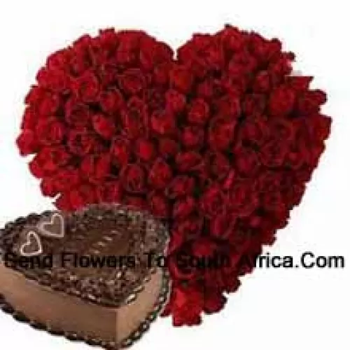 Heart Shaped Arrangement Of 100 Red Roses Along With 1 Kg Heart Shaped Chocolate Cake