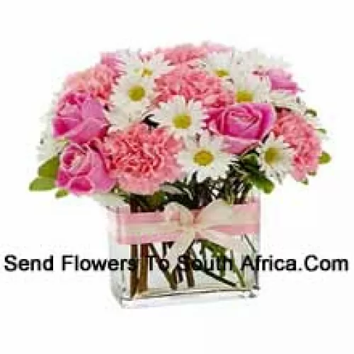 Pink Roses, Pink Carnations And Assorted White Seasonal Flowers Arranged Beautifully In A Glass Vase