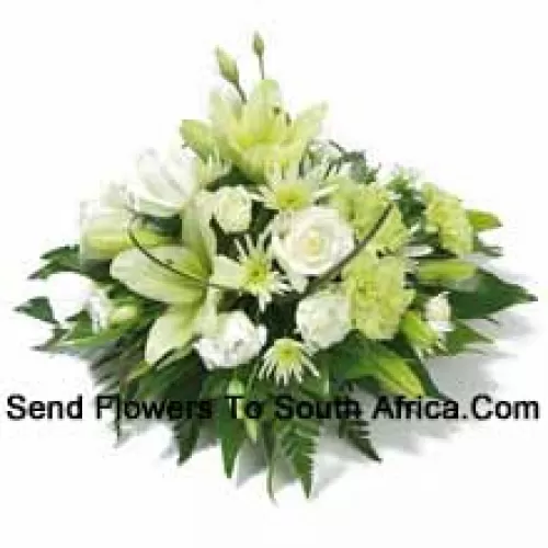 A Beautiful Arrangement Of White Roses, White Carnations, White Lilies And Assorted White Flowers With Seasonal Fillers