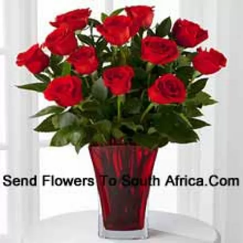 12 Red Roses With Some Ferns In A Vase