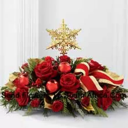 A grand and elegant way to add to the beauty of their holiday festivities. Rich red roses and spray roses are arranged with assorted holiday greens, variegated holly, shiny red holiday balls and a gold-edged red ribbon, all encircling a gold metallic star-shaped tree topper to create a unique and sophisticated holiday centerpiece.? (Please Note That We Reserve The Right To Substitute Any Product With A Suitable Product Of Equal Value In Case Of Non-Availability Of A Certain Product)