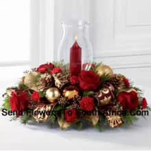 The Golden Christmas Centerpiece is the perfect display of holiday warmth and cheer to gather your friends and family together. Bright red roses and mini carnations are gorgeously arranged with holiday greens and seeded eucalyptus accented with golden pinecones, gold and copper glass balls, and burgundy and gold wired ribbon encircling a glass hurricane. (Please Note That We Reserve The Right To Substitute Any Product With A Suitable Product Of Equal Value In Case Of Non-Availability Of A Certain Product)